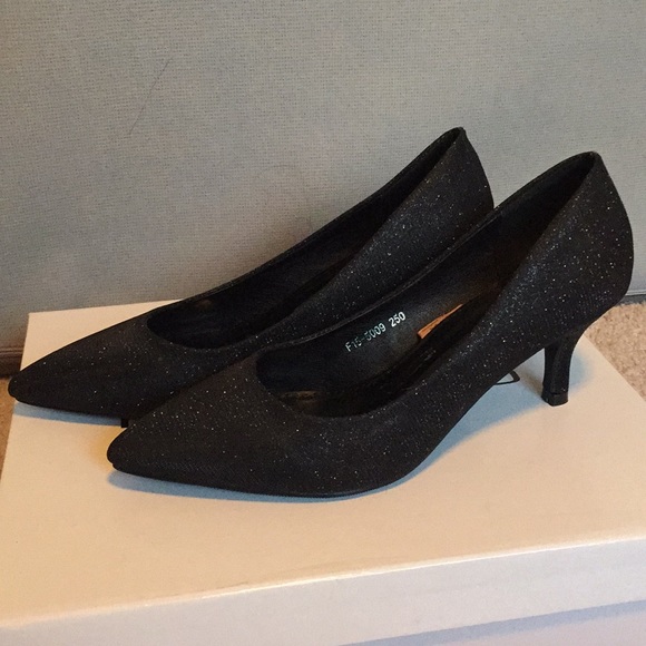 black transparent pumps